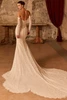 Back view of Pronovias Peia strapless Chantilly lace wedding gown with fitted silhouette and lace train