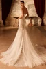 Back view of Sagey strapless mermaid wedding dress with fitted lace silhouette and tulle train