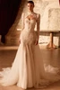Front view of Pronovias Sagey Chantilly lace mermaid wedding dress with bolero and overskirt