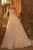 Front view of Pronovias Wrem lace ball gown with detachable sleeves and choker
