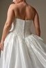 Back detail of Alvarez dress showing corset closure and covered buttons