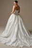 Back view of Alvarez dress showing covered buttons and floral lace train