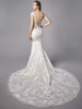 Deep illusion back meets figure-hugging silhouette and flows into a stunning lace cathedral train