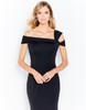 Asymmetrical strap and off-shoulder wrap create bold structure and clean lines