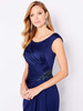 Boat neckline and shimmering side embellishment accent a pleated satin silhouette