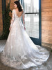 A plunging V-back meets cascading floral lace and a soft, flowing cathedral train