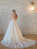 Low scoop back with cascading sparkle layers and sweeping chapel train