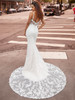 Joy 2502 dramatic back with sheer chapel train and button detail.