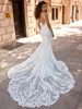 Back view of Joan 2521 dress with open back and sheer petal train