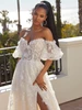 Three-quarter view of Magdalena 2558 dress with detachable pouf sleeves and slit