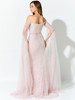 Off-shoulder shimmer and soft trailing tulle create elegant movement from every angle