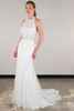 Sheer lace halter bodice meets a fitted skirt with ornate embroidery and soft train