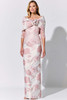 A rose-draped collar wraps this blush gown in vintage charm and elegant grace