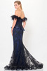 Back view of navy gown with feather trim and dramatic lace train