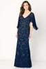 Navy gown sparkles with sheer flutter sleeves and a vine-beaded silhouette