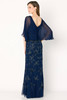 V-back with soft chiffon overlay adds flow and elegance to the embroidered gown
