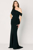 Textured black shimmer gown with slit skirt and soft cascading ruffle accent