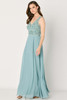 Sleeveless V-neck bodice sparkles with beadwork above a flowing chiffon skirt