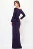 Faux button back and layered peplum bring elegance to this structured gown