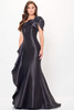 Bold black mermaid silhouette with oversized ruffle shoulder and asymmetric neckline