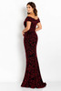 Draped off-shoulder sleeves and subtle train enhance this fitted red glitter gown
