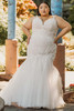 Bold embroidery sculpts the bodice with a flattering mermaid flare