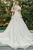 Back view of 7940 dress with detachable puff sleeves and full train