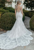 Back view of 7941 lace dress with low illusion back and shaped train