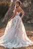 Back view of A1217 dress showing lace appliques and flowing train