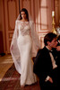 royal-inspired crepe gown, featuring vintage lace and beading
