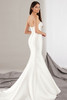 Strapless gown with covered buttons trailing down a fitted back and elegant flare train.