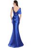 Elegant open back with ruffle detail and floral applique on sleek trumpet skirt.