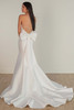 A dramatic detachable bow and illusion corset back add playful elegance to this sleek bridal gown