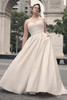 Maggie Sottero Anniston glitter tulle gown featuring asymmetrical ruched bodice and full skirt