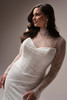 Detailed view of the Sasha gown's optional illusion jacket, showcasing the delicate lace and elegant long sleeves.