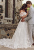 Romantic side view of the Skylar wedding dress, highlighting the heirloom lace motif and sparkle tulle skirt Romantic side view of the Skylar wedding dress, highlighting the heirloom lace motif and sparkle tulle skirt