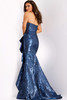 Back view of mermaid gown revealing sleek silhouette and long sweeping train.