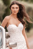 Allure Bridals A1304 close-up—lace bodice with intricate floral embroidery and scalloped edges.
