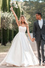 Allure Bridals A1307 styled with groom—ballgown featuring beaded bodice and flowing Mikado skirt.