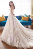 Back view of Martin Thornburg MT5105 gown with illusion bodice and cathedral train.