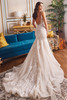 Back view of Martin Thornburg MT5117 gown with low back, glitter tulle, and cathedral train.