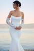 Close-up of bodice of Sophia Tolli Y3180 capturing draping, lace back, and soft scoop neckline.