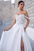 Close-up of the bodice of Sophia Tolli Y3184 capturing floral lace appliqués, sheer corset structure, and off-shoulder neckline.