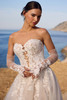 Detail of the glove / lace gauntlet accessory that comes with Sophia Tolli Y3190, showing its illusion lace design.