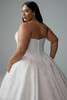 Detail of the back skirt panels and train focusing on the jacquard fabric and fullness of the ball gown silhouette