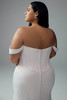 Back view showing fabric-covered buttons down center back, natural waistline, and full sheath skirt without slit.
