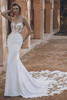 Bride in Enzoani Unique sheath gown with sweetheart neckline and fitted silhouette.