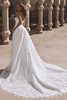 Back view of Enzoani Venice gown featuring lace train and detachable overskirt.