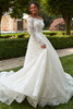 Side angle of Penelope showing flowing organza skirt with lace overlay.