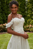 Bride in Petunia highlighting detachable off-the-shoulder straps.